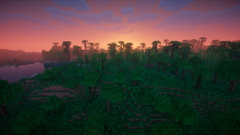 Vista aérea de uma selva no servidor Minecraft ao pôr do sol.