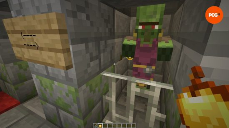 Um aldeão zumbi preso no porão de um iglu em uma das melhores seeds do Minecraft na versão 1.20.