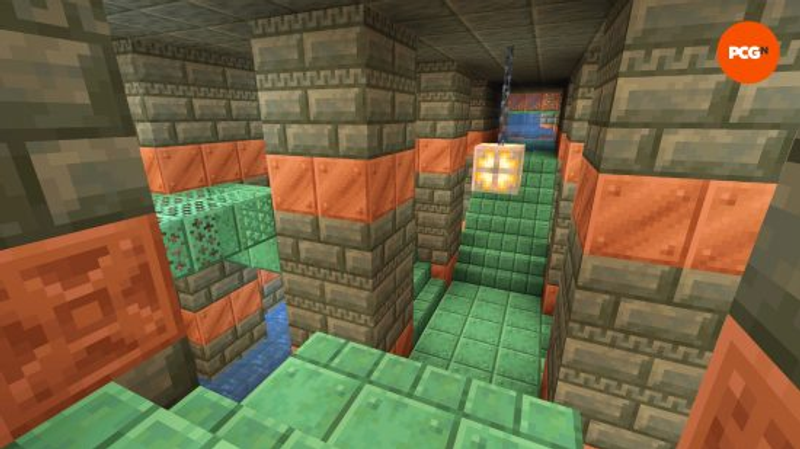 the copper and stone interior of a Minecraft Trial Chamber that can be found in one of the best 1.21 Minecraft seeds.